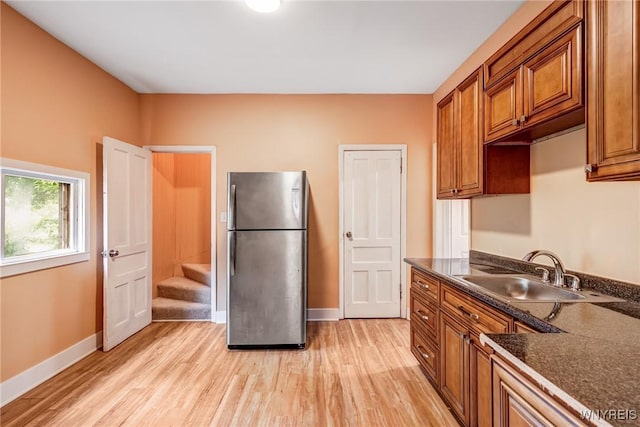 285 E N St Unit S, Buffalo, NY 14204 - kitchen featuring freestanding refrigerator, brown cabinetry, and light wood finished floors