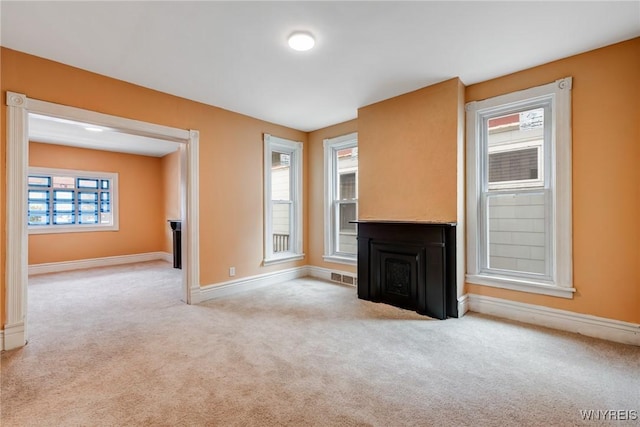 285 E N St Unit S, Buffalo, NY 14204 - unfurnished living room with baseboards and carpet flooring