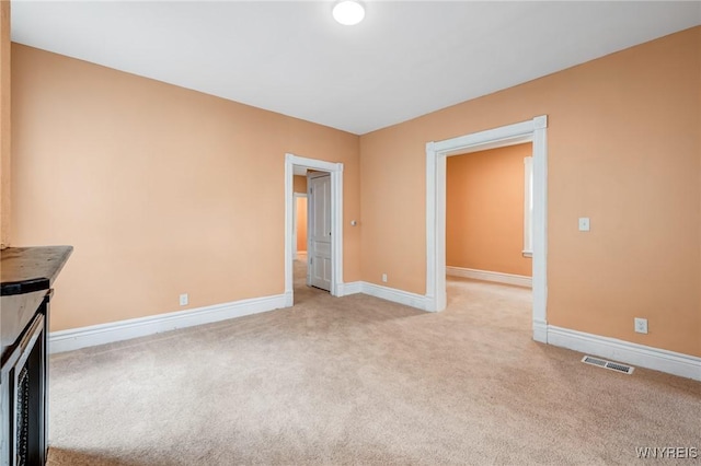 285 E N St Unit S, Buffalo, NY 14204 - unfurnished living room featuring light colored carpet and baseboards