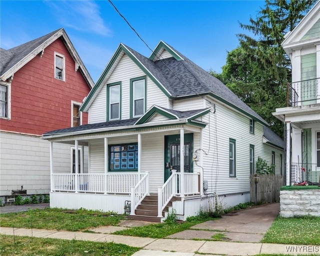 285 E N St Unit S, Buffalo, NY 14204 - view of front of house featuring covered porch and roof with shingles