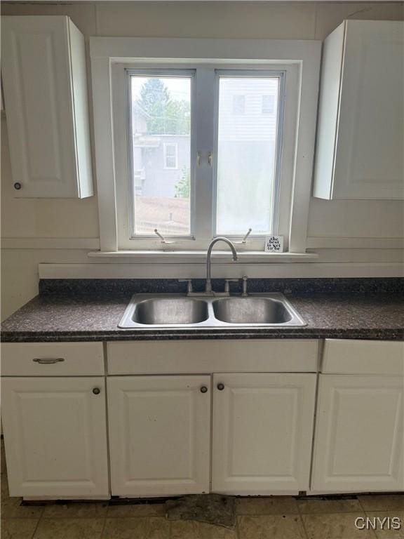 8 Spring St, Auburn, NY 13021 - kitchen with dark countertops and white cabinetry