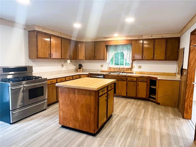 33 E Vanscoter St, Hornell, NY 14843 - kitchen featuring appliances with stainless steel finishes, butcher block countertops, light wood finished floors, brown cabinetry, and recessed lighting