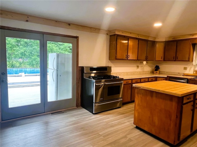 33 E Vanscoter St, Hornell, NY 14843 - kitchen with stainless steel appliances, wooden counters, light wood-style floors, a kitchen island, and recessed lighting
