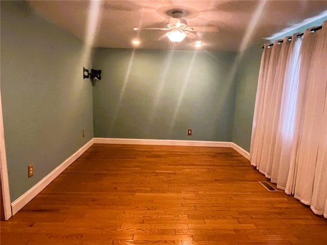 33 E Vanscoter St, Hornell, NY 14843 - empty room with a ceiling fan and hardwood / wood-style flooring