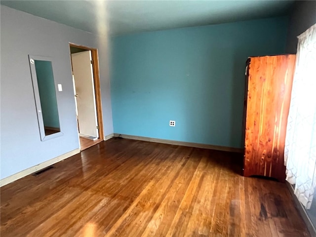 33 E Vanscoter St, Hornell, NY 14843 - spare room with wood finished floors and healthy amount of natural light