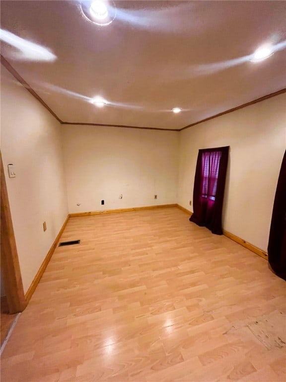 33 E Vanscoter St, Hornell, NY 14843 - unfurnished room featuring light wood-type flooring and crown molding