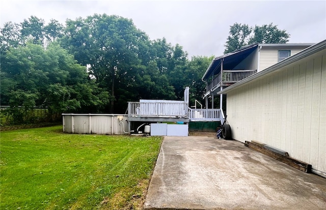 33 E Vanscoter St, Hornell, NY 14843 - view of grassy yard with a pool, a deck, and a patio
