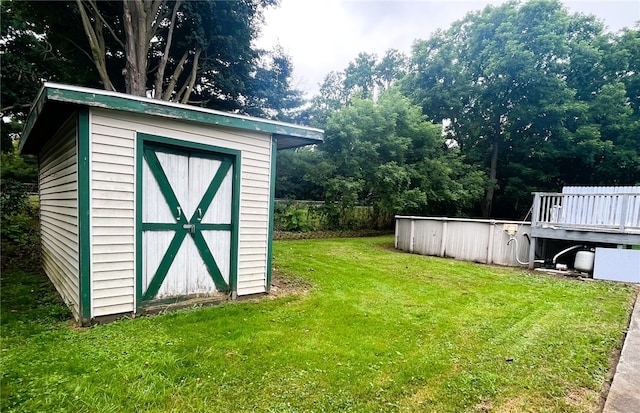 33 E Vanscoter St, Hornell, NY 14843 - view of green lawn with a storage shed and a swimming pool