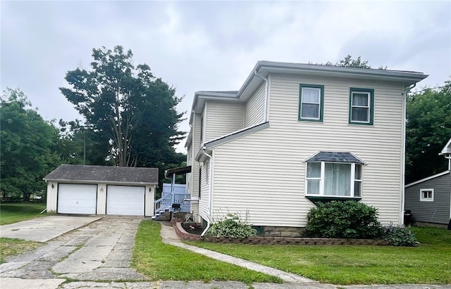 33 E Vanscoter St, Hornell, NY 14843 - view of side of home featuring an outbuilding, a detached garage, and a lawn