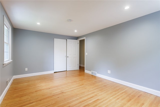 32 White Birch Cir, Chili, NY 14624 - unfurnished bedroom with light wood-type flooring and recessed lighting