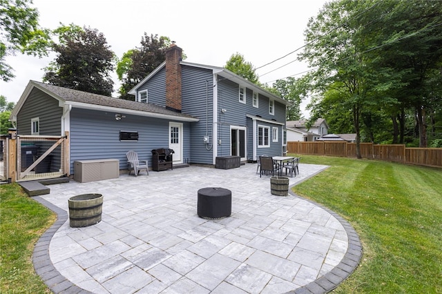 32 White Birch Cir, Chili, NY 14624 - rear view of house with a gate, a chimney, a patio, and an outdoor fire pit