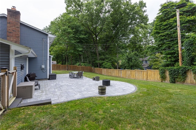 32 White Birch Cir, Chili, NY 14624 - fenced backyard with a patio area