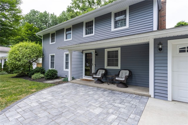32 White Birch Cir, Chili, NY 14624 - view of front of home featuring a garage and covered porch