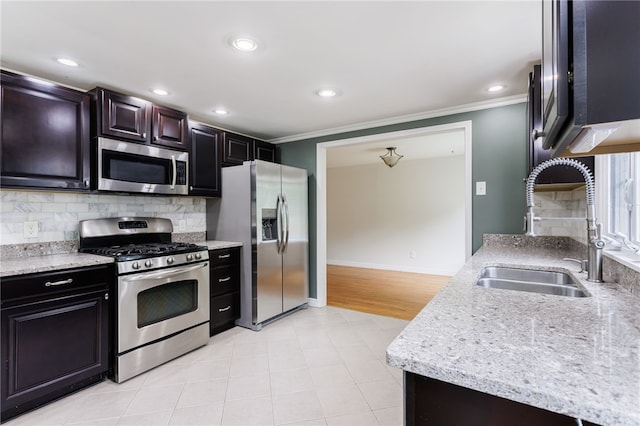 32 White Birch Cir, Chili, NY 14624 - kitchen with appliances with stainless steel finishes, crown molding, decorative backsplash, recessed lighting, and light stone countertops