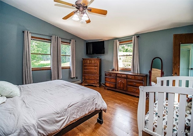 4022 W Milestrip Rd, Fenner, NY 13032 - bedroom featuring lofted ceiling, wood finished floors, and ceiling fan