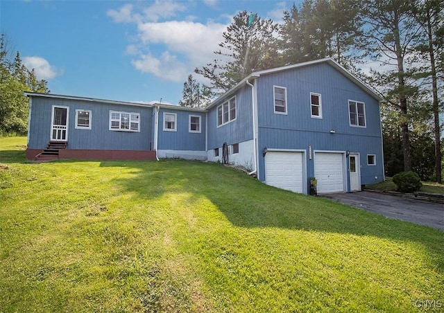 4022 W Milestrip Rd, Fenner, NY 13032 - back of house featuring a garage, asphalt driveway, and a yard