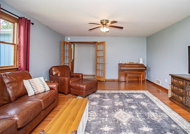 4022 W Milestrip Rd, Fenner, NY 13032 - living area featuring wood finished floors and ceiling fan