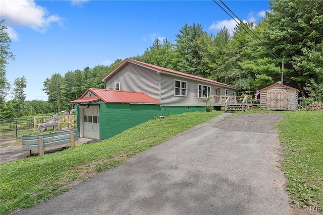 1037 County Route 17, Constantia, NY 13028 - view of side of home featuring a storage unit and a deck