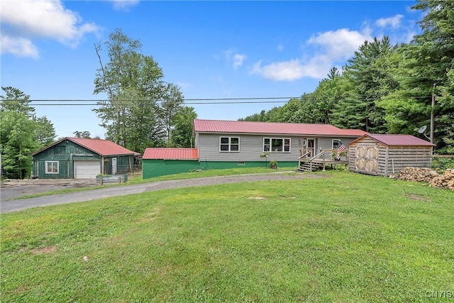 1037 County Route 17, Constantia, NY 13028 - ranch-style home with a garage, a metal roof, a front yard, and a storage shed