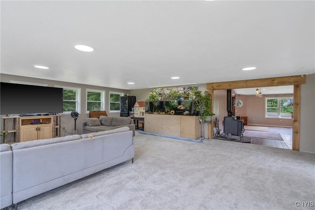 1037 County Route 17, Constantia, NY 13028 - carpeted living room featuring recessed lighting and a wood stove