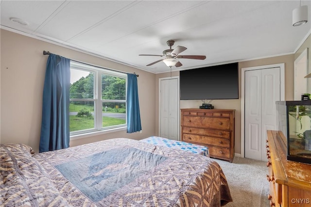 1037 County Route 17, Constantia, NY 13028 - bedroom featuring carpet flooring, two closets, ornamental molding, and a ceiling fan