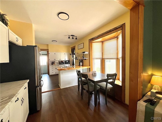 66 N Gordon St, Gouverneur, NY 13642 - dining space with dark wood-style floors