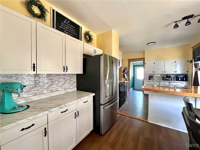 66 N Gordon St, Gouverneur, NY 13642 - kitchen with stainless steel refrigerator with ice dispenser, dark wood-type flooring, tasteful backsplash, white cabinets, and electric range