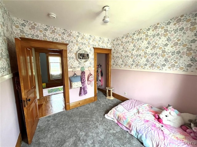 66 N Gordon St, Gouverneur, NY 13642 - carpeted bedroom with wallpapered walls and wainscoting