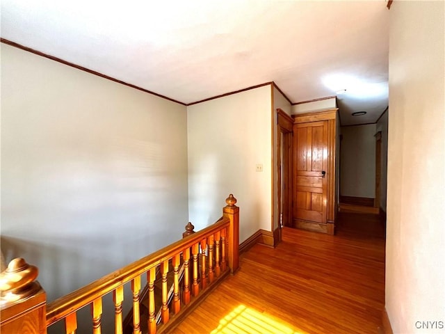 66 N Gordon St, Gouverneur, NY 13642 - hallway with an upstairs landing, crown molding, and light wood-type flooring