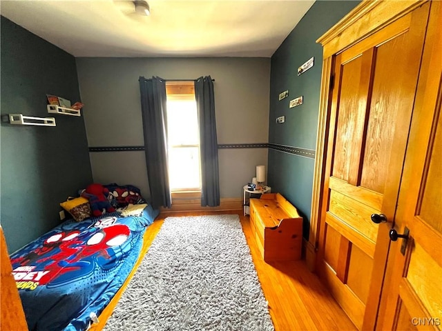 66 N Gordon St, Gouverneur, NY 13642 - bedroom with light wood-type flooring and baseboards