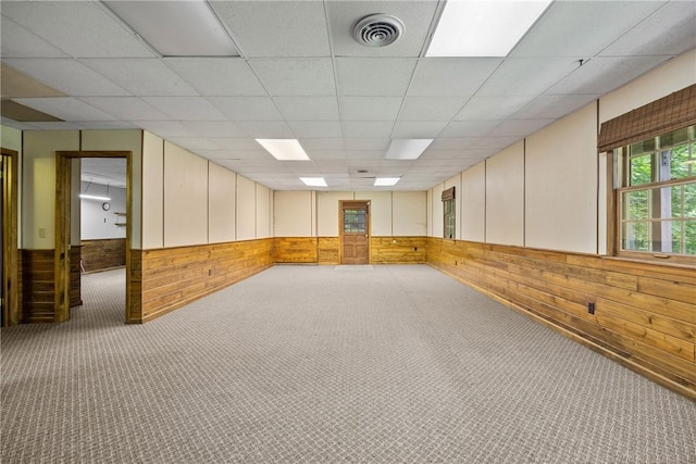 790 Oakridge Dr, Irondequoit, NY 14617 - carpeted spare room featuring wood walls, a drop ceiling, and a wainscoted wall