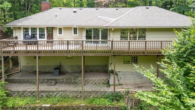 790 Oakridge Dr, Irondequoit, NY 14617 - rear view of house featuring a chimney, a wooden deck, and a shingled roof
