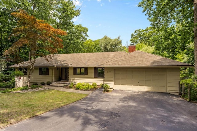 790 Oakridge Dr, Irondequoit, NY 14617 - ranch-style home featuring driveway, a chimney, a front yard, a garage, and a shingled roof