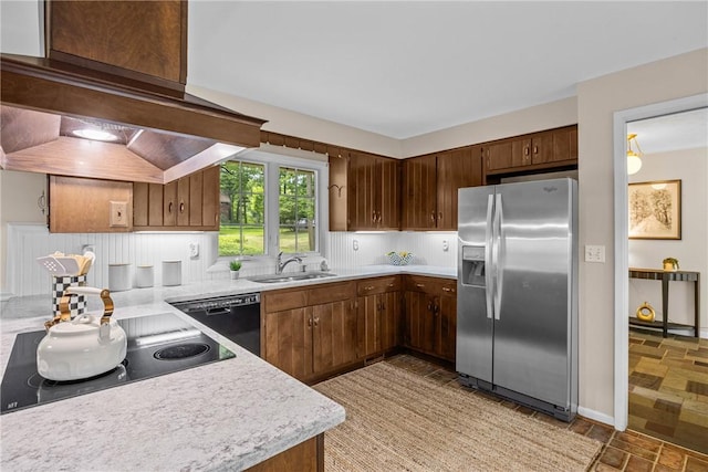 790 Oakridge Dr, Irondequoit, NY 14617 - kitchen featuring stainless steel fridge with ice dispenser, dishwasher, light countertops, exhaust hood, and light stone finish floors