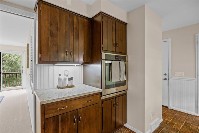 790 Oakridge Dr, Irondequoit, NY 14617 - kitchen featuring stainless steel oven and light stone countertops