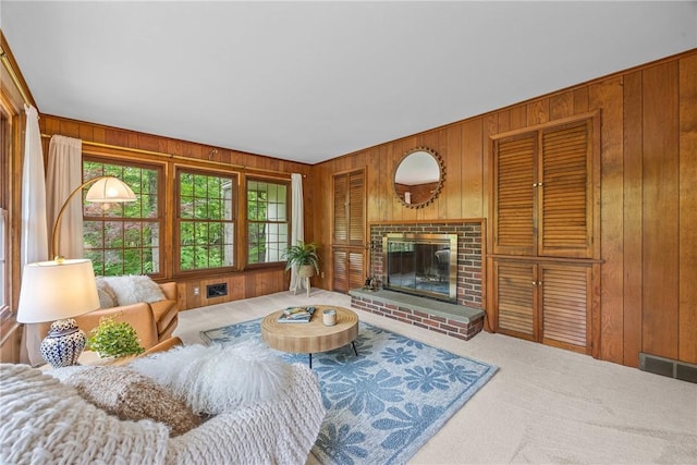 790 Oakridge Dr, Irondequoit, NY 14617 - carpeted living room featuring wood walls and a fireplace