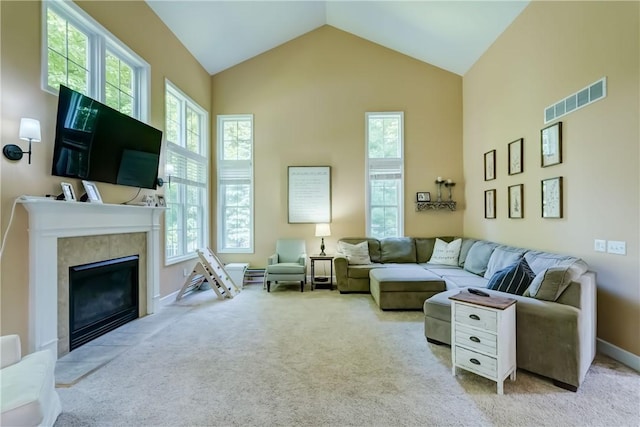 906 Lothario Cir, Webster, NY 14580 - living area featuring carpet floors, a fireplace with flush hearth, and high vaulted ceiling