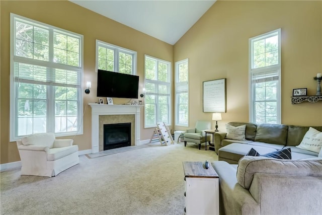 906 Lothario Cir, Webster, NY 14580 - living room featuring a fireplace with flush hearth, carpet flooring, and high vaulted ceiling