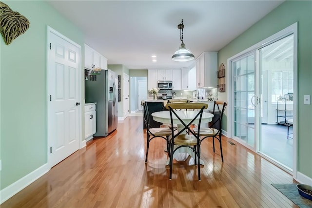 906 Lothario Cir, Webster, NY 14580 - dining area with light wood-style flooring and recessed lighting