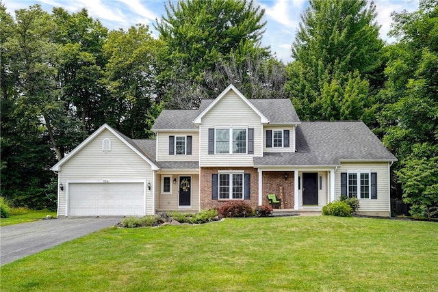 906 Lothario Cir, Webster, NY 14580 - traditional-style house featuring driveway, an attached garage, a front lawn, and a shingled roof
