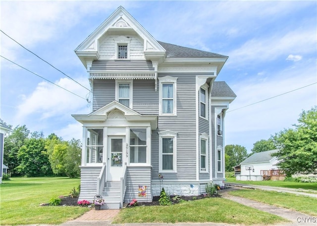 20199 County Route 181, Orleans, NY 13656 - victorian home featuring a sunroom and a front yard