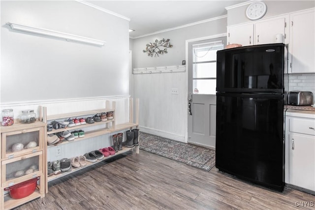 20199 County Route 181, Orleans, NY 13656 - kitchen with freestanding refrigerator, white cabinetry, ornamental molding, light wood finished floors, and wainscoting