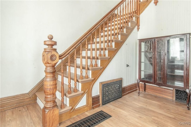 20199 County Route 181, Orleans, NY 13656 - staircase featuring wood finished floors and a towering ceiling