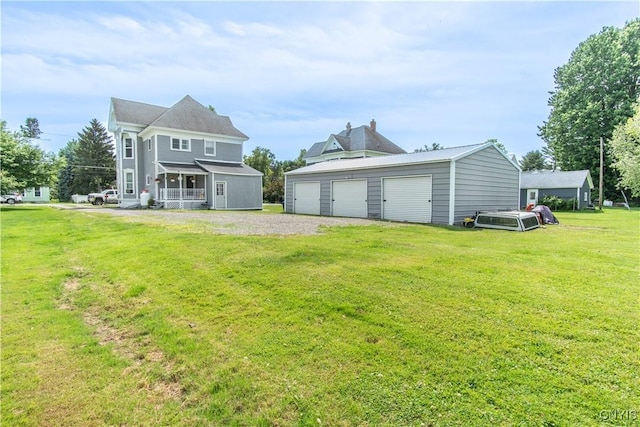 20199 County Route 181, Orleans, NY 13656 - back of property with an outbuilding, a garage, and a lawn