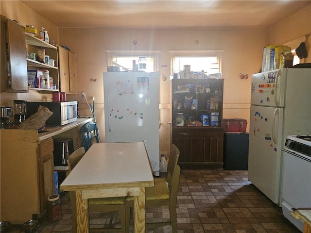 16 Seabrook St Unit 2, Rochester, NY 14621 - kitchen with white appliances, open shelves, and brick patterned floors