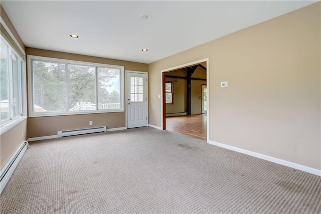 1566 Tracy Dr, Spafford, NY 13152 - empty room with a baseboard radiator, light colored carpet, and recessed lighting