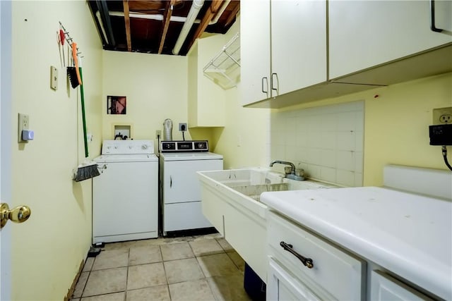 1566 Tracy Dr, Spafford, NY 13152 - laundry room featuring cabinet space, washing machine and dryer, and light tile patterned flooring