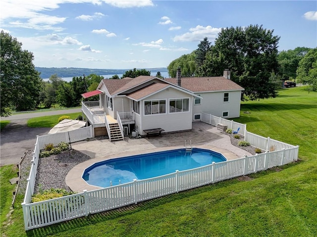 1566 Tracy Dr, Spafford, NY 13152 - rear view of house with a fenced backyard, a deck, a chimney, and stairs