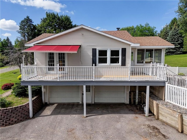 1566 Tracy Dr, Spafford, NY 13152 - view of front of home with an attached garage, driveway, a shingled roof, and french doors