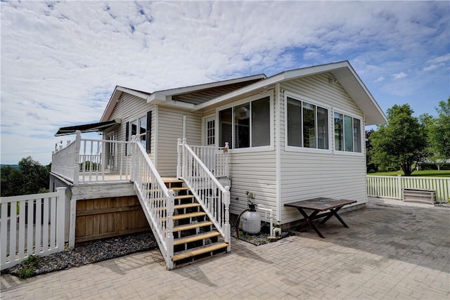 1566 Tracy Dr, Spafford, NY 13152 - rear view of house featuring stairs, a patio, and a wooden deck